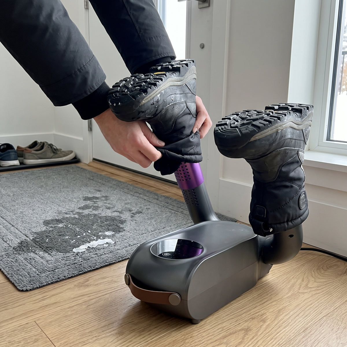 Graphite Slawor dryer, placing a wet winter boot on the arm